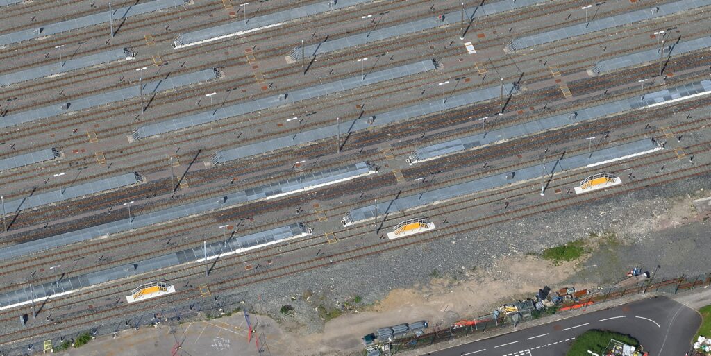 An aerial view of three GRP Drivers Access Platforms alongside a track