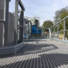 Standard Open Mesh GRP Grating on a raised maintenance platform with GRP Handrail either side