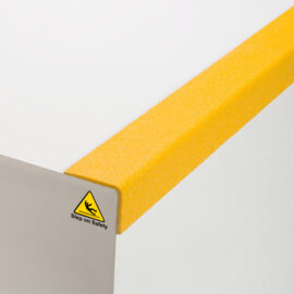 GRP Anti Slip Stair Nosing | Close up of yellow QuartzGrip GRP stair nosing showing the anti slip finish