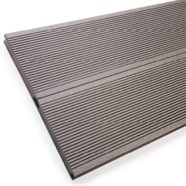 Close up of RecoDeck solid WPC decking boards in grooved light grey finish