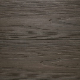 Close up of RecoDeck Walnut composite Decking boards showing the slip-resistant woodgrain finish
