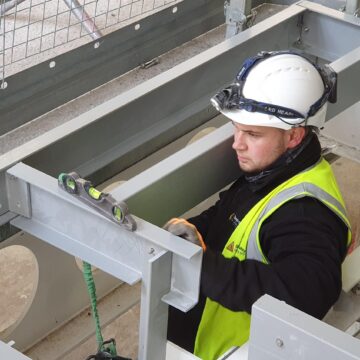 Step on Safety site team installing a riser floor