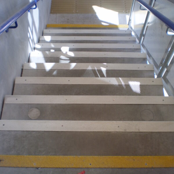 Concrete steps fitted with yellow and white QuartzGrip Anti-Slip Stair Nosing