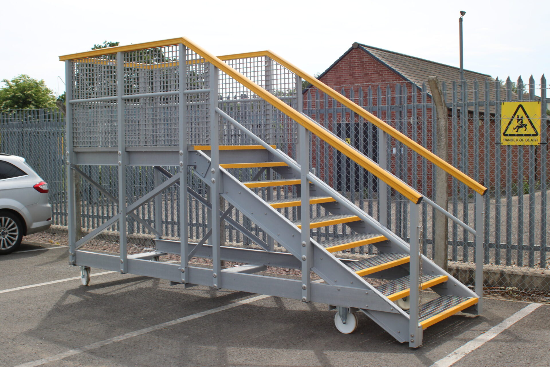 Mobile access platform designed to give visitors to a recycling plant safe access to the containers used to collect waste. Built using GRP profiles, handrail and anti-slip QuartzGrip open mesh grating
