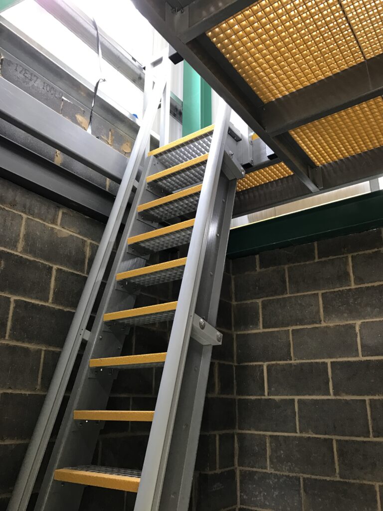 GRP Fixed Access Ships Ladder leading up through a GRP Open Mesh floor