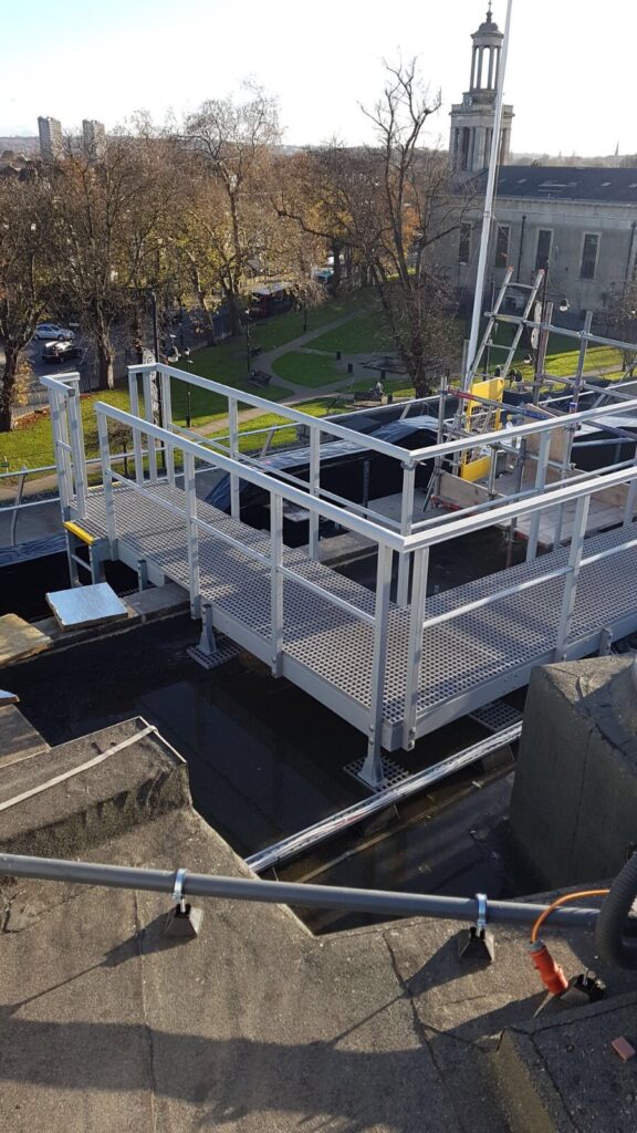 Roof-top walkway providing safe access to maintenance crews