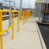 Photo looking along a GRP handrail at a railway depot in Cambridge