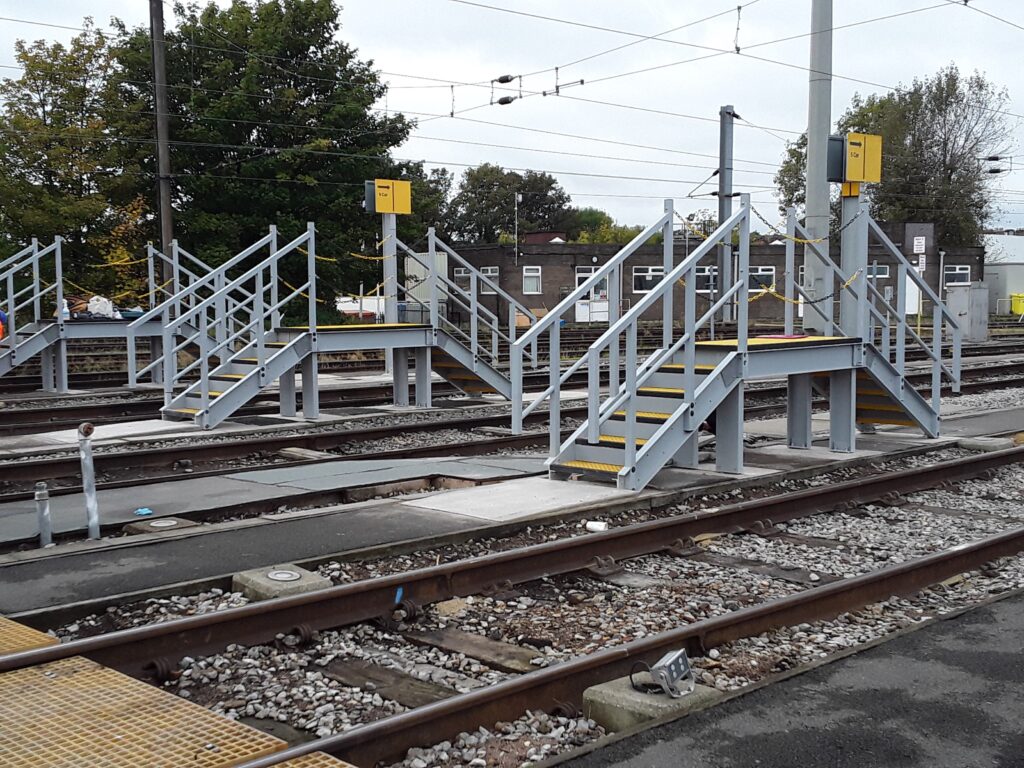 Double-sided GRP Drivers Access Platforms between railway tracks in a depot