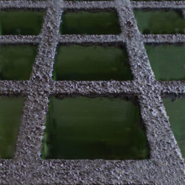 Close up of green GRP grating with a non-conductive coating