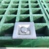 Square Fixing Clip used on green GRP Open Mesh Grating