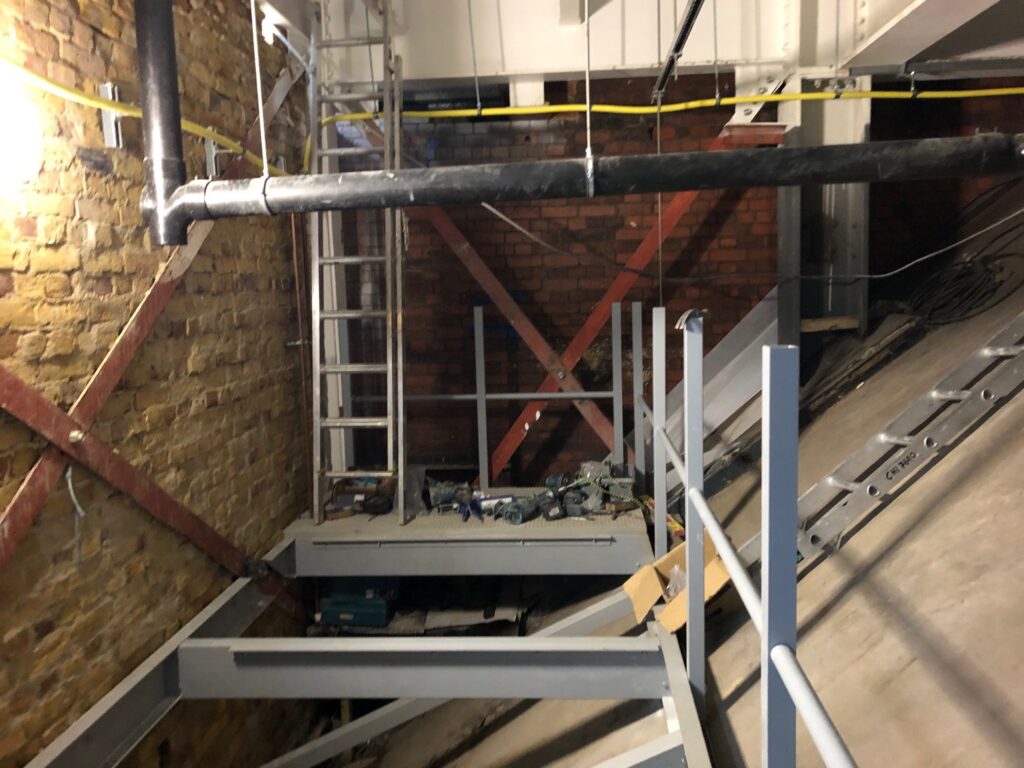 Construction of a suspended walkway at KOKO in Camden. Photo shows the GRP profile structure in place