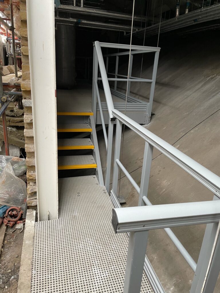 Completed GRP suspended walkway at KOKO in Camden looking at the access steps and GRP handrail