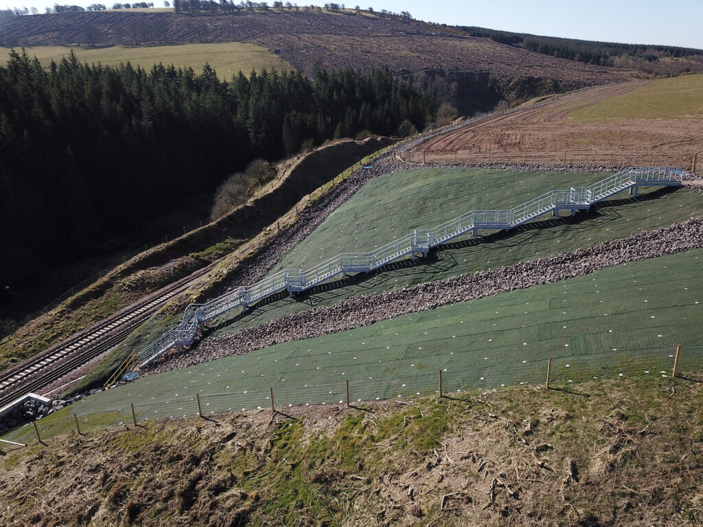 Aerial view of thhe new GRP Embankment stairs going down to the site of the 2019 fatal rail incident near Stonehaven, Carmont.