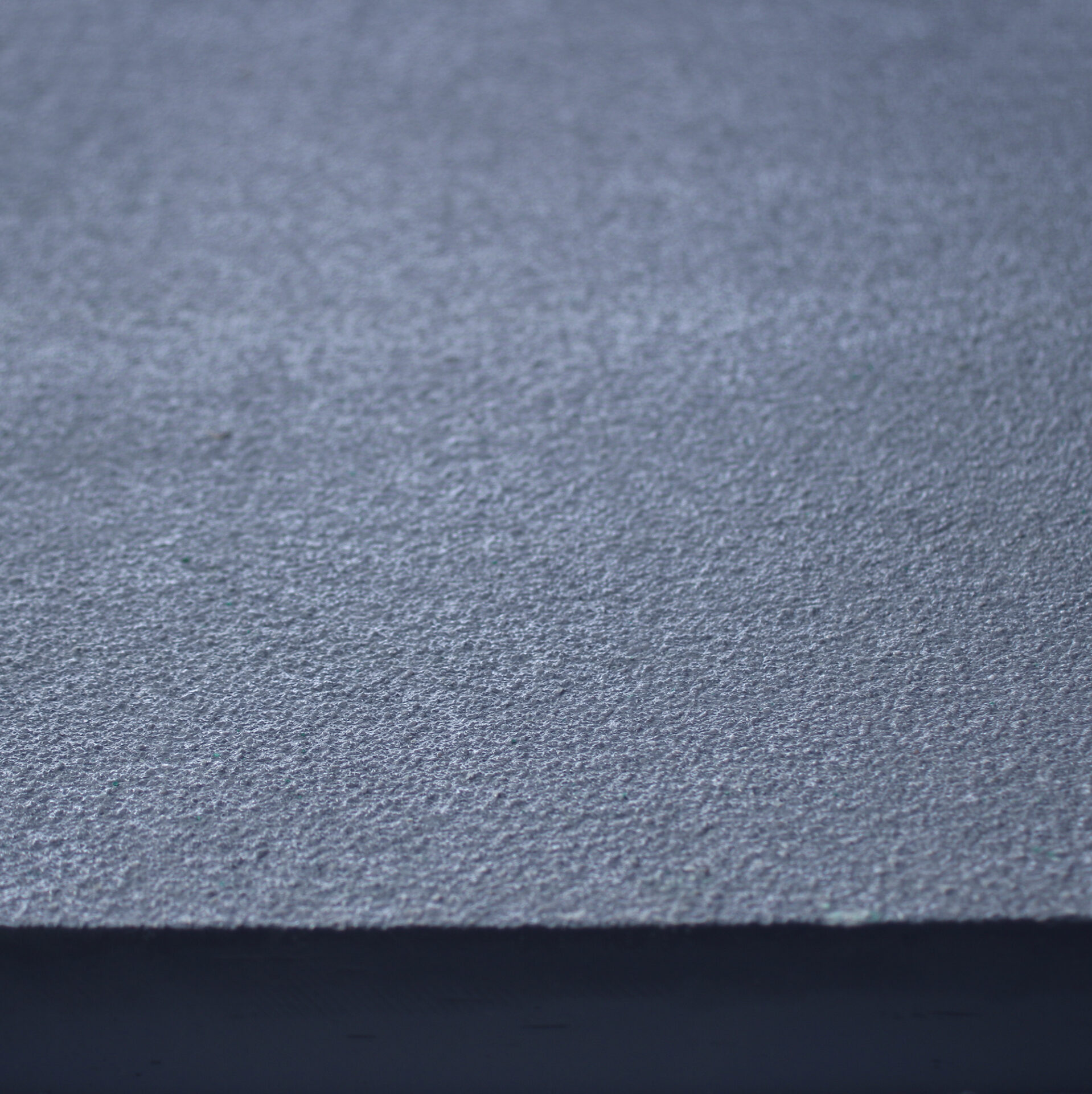 Close up of the slip resistant finish on GRP Solid top in grey