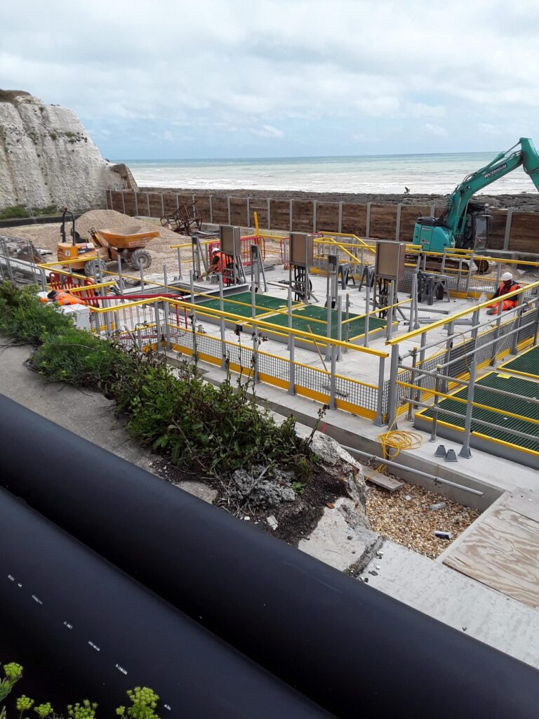 Photo taken from the cliffs of work taking place at the Portobello Pumping Station