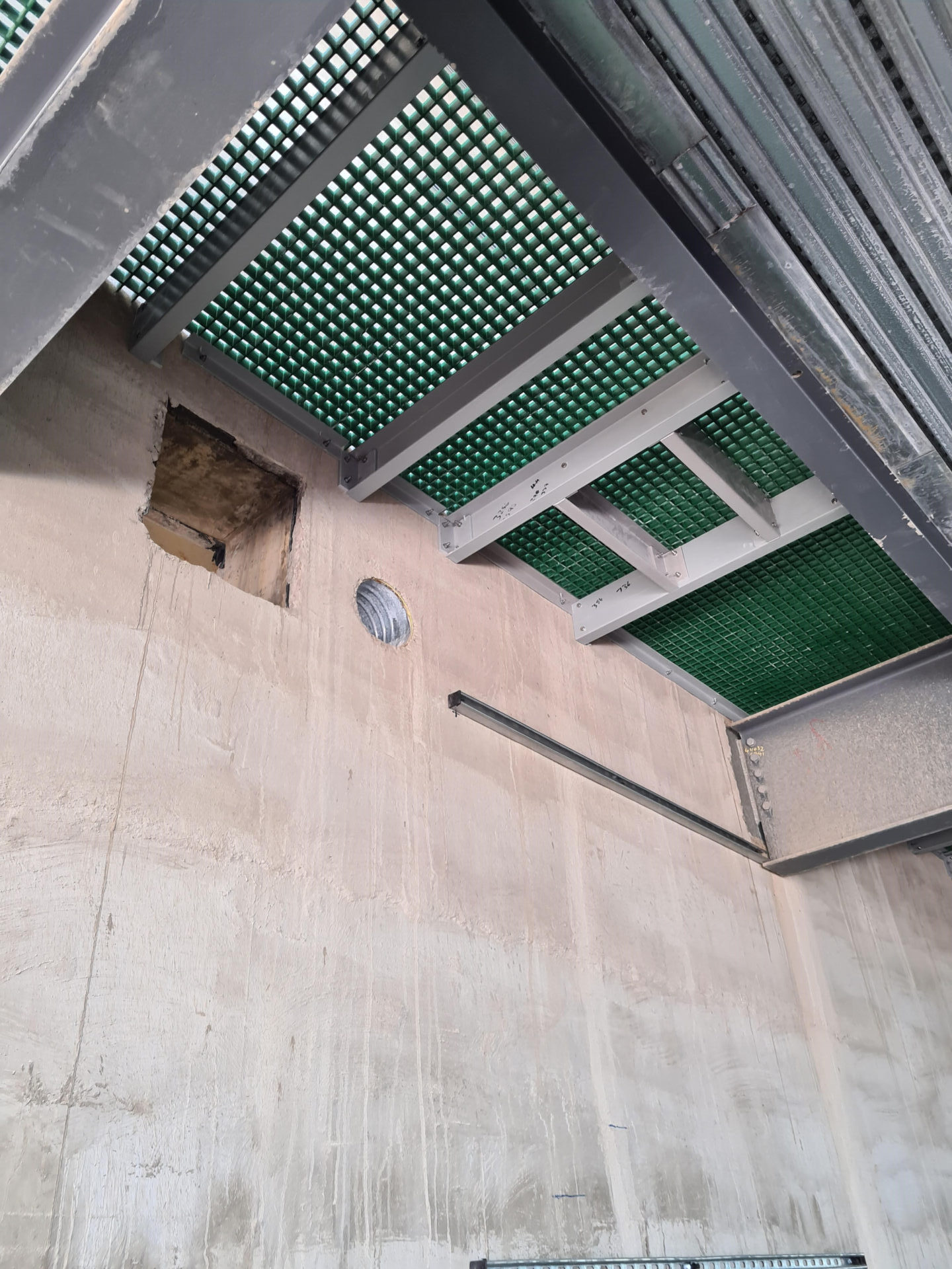 Service Riser floor at 103 Colmore Row photographed from below to show the extra supports