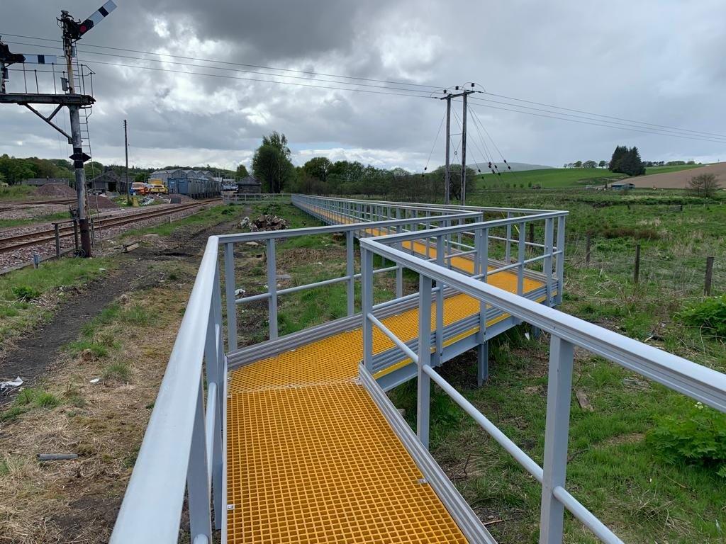 The new raised GRP walkway had to navigate the cables running to the signal box