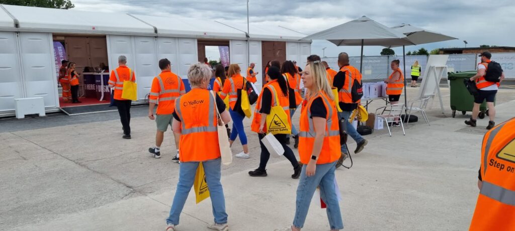 People leaving Rail Live with Step on Safety tote bags