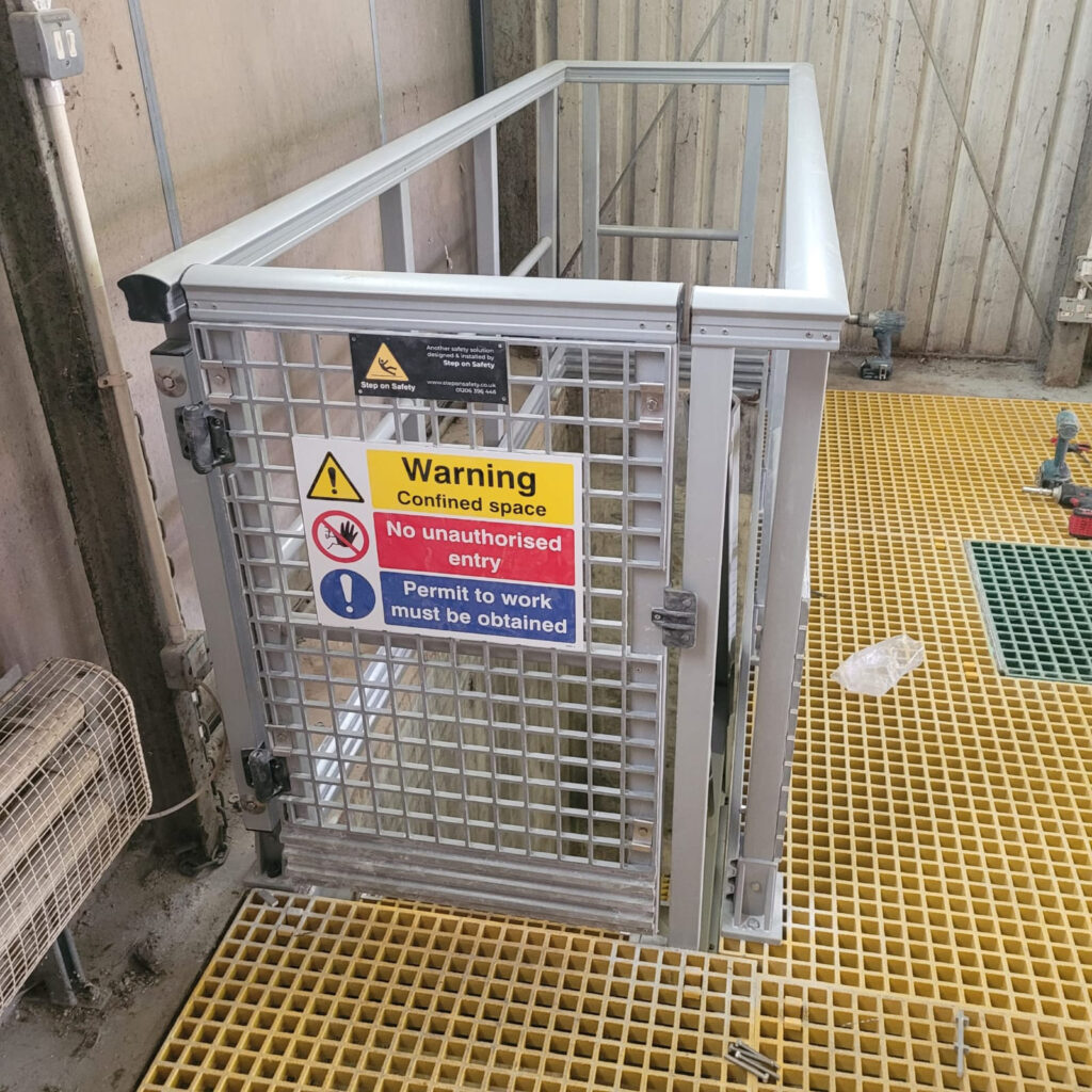 A self-closing safety gate at the top of the stairs leading down to the lower levels at Belton Gardens Pumping Station