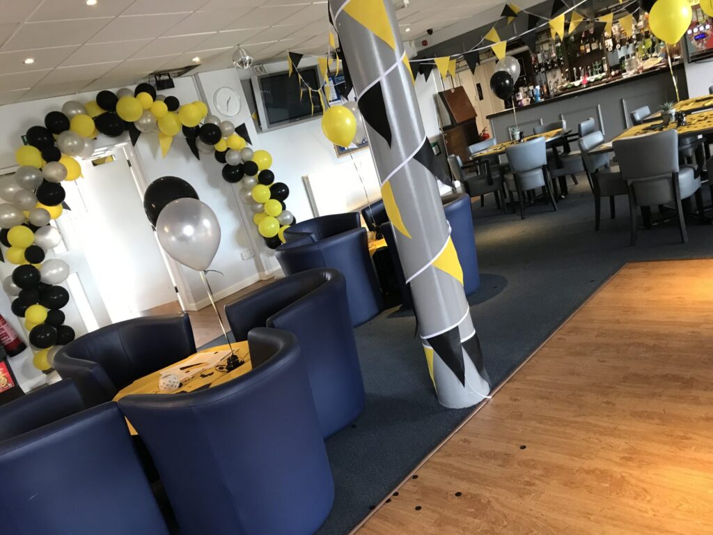 Brantham Leisure Centre decorated with Step on Safety black and yellow bunting and balloons