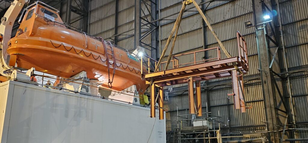 A phenolic GRP platform being lifted into place by a crane